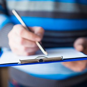 Patient filling out a dental insurance form