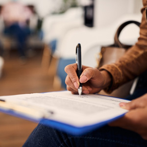 Patient filling out paperwork in lobby