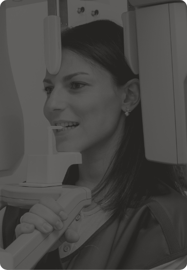 Woman getting dental scans of her mouth and jaw