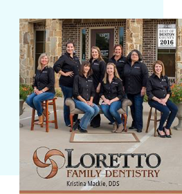 Loretto Family Dentistry team sitting in chairs in front of dental office building