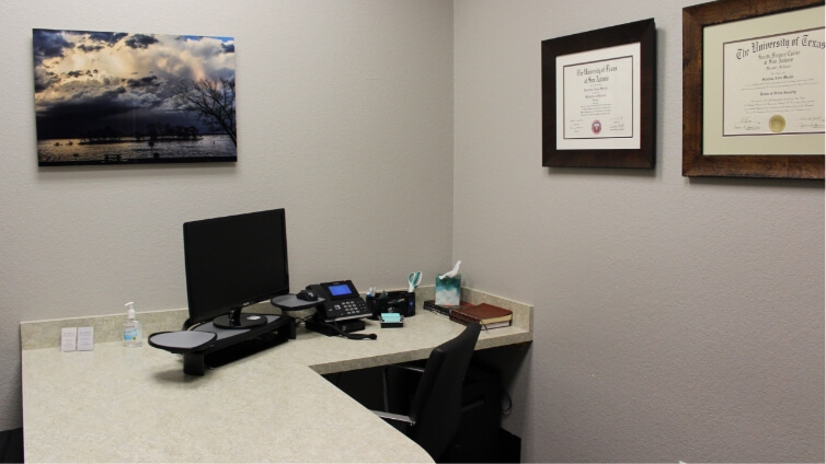 Desk with computer in consultation room