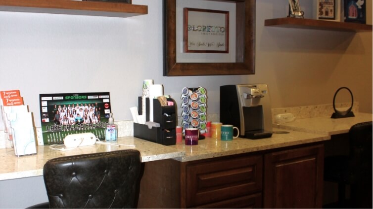 Countertop with pamphlets and coffee machine