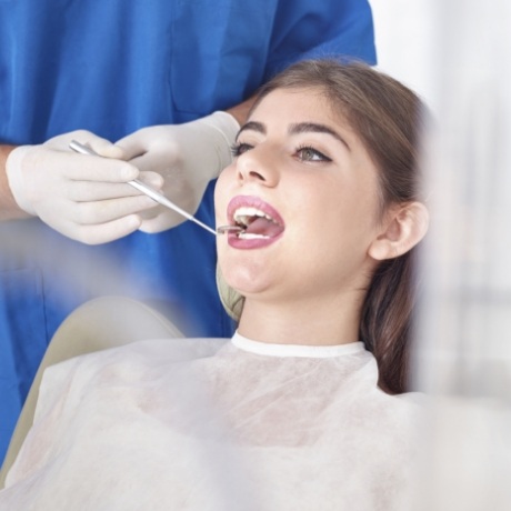 Woman receiving a preventive dentistry checkup