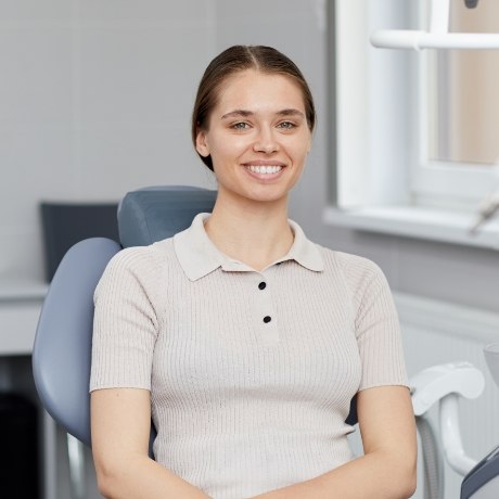 Smiling woman sitting in dental chair