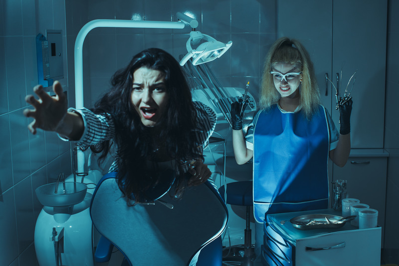Patient and dentist dressed for Halloween fighting dental anxiety.